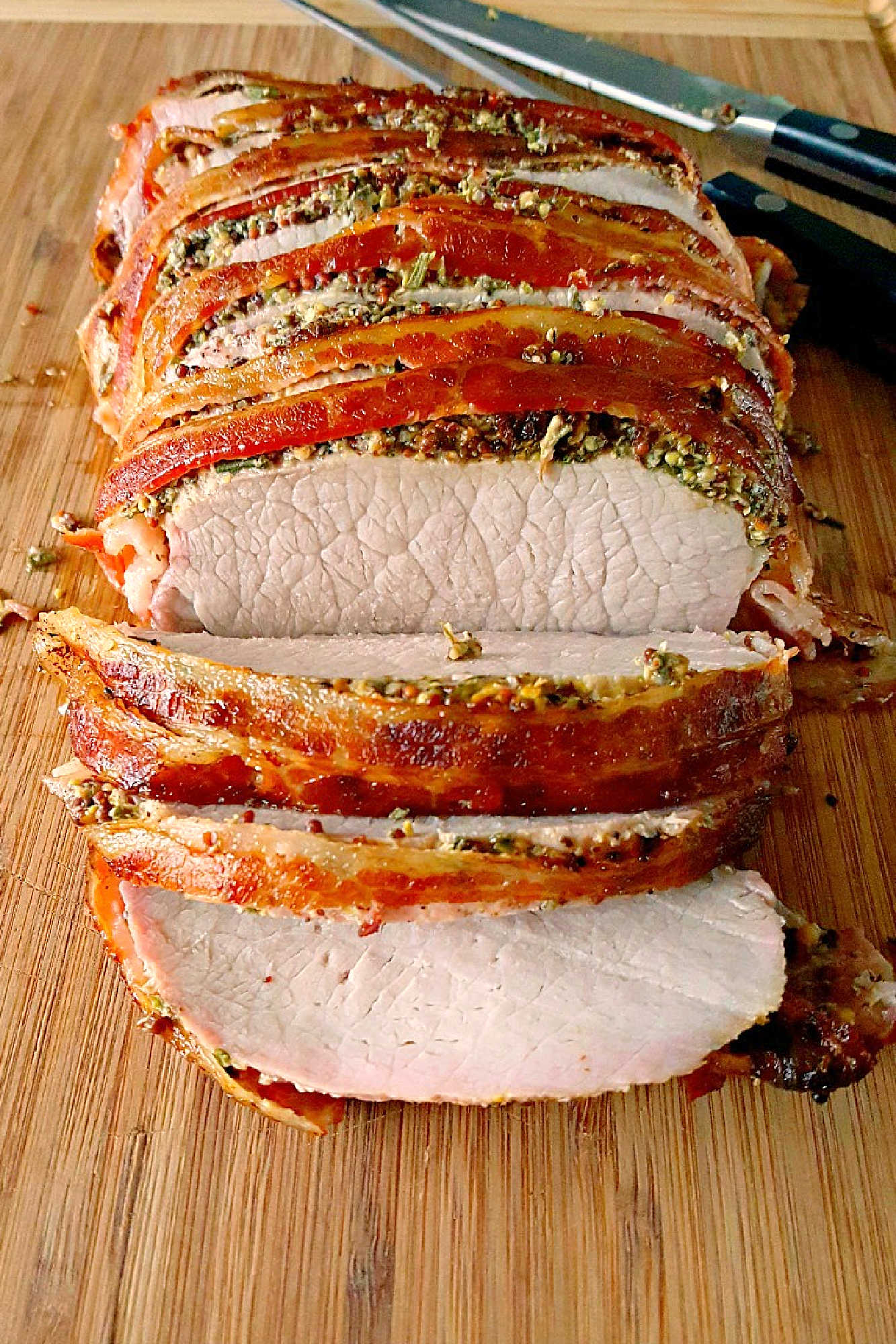 Experience layers of flavor with our Bacon Wellington Pork Roast, where savory bacon wraps perfectly seasoned pork tenderloin for an unforgettable meal. Indulge in the ultimate comfort food.  #OurFamilyTable #BaconWellington #PorkRoast #DeliciousDinner #FoodieFaves #WeeknightMeals