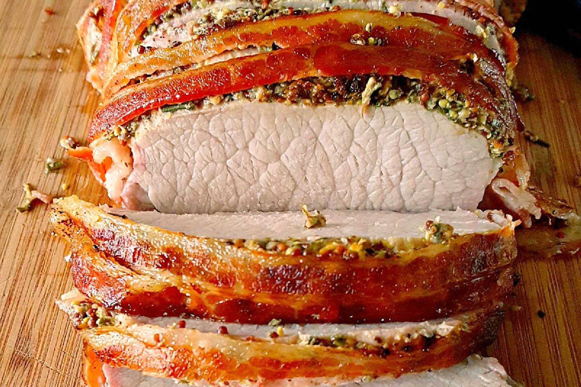 Experience layers of flavor with our Bacon Wellington Pork Roast, where savory bacon wraps perfectly seasoned pork tenderloin for an unforgettable meal. Indulge in the ultimate comfort food. #OurFamilyTable #BaconWellington #PorkRoast #DeliciousDinner #FoodieFaves #WeeknightMeals