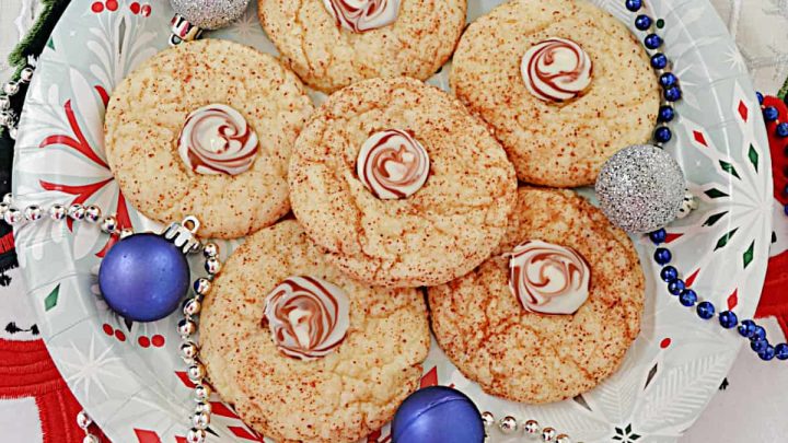 Amazing Cappuccino Swirl Cookies have just a hint of coffee flavor paired with a rich, chocolate center thanks to adding a Hershey's Hug after baking. #cookies #coffee #holidays #dessert