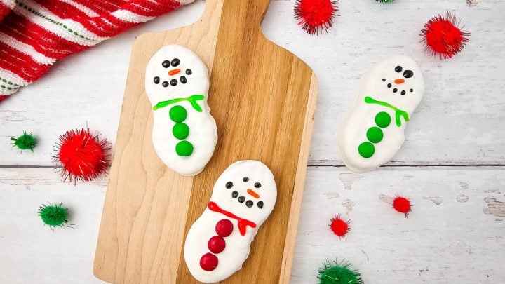 Adorable Nutter Butter Snowman Cookies are a fun, no-bake holiday treat! Perfect for kids to decorate and festive for holiday cookie trays.