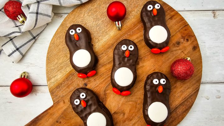 Penguin Nutter Butter Cookies are cute, no-bake holiday treats perfect for parties, dessert trays, and a fun Christmas activity with kids.
