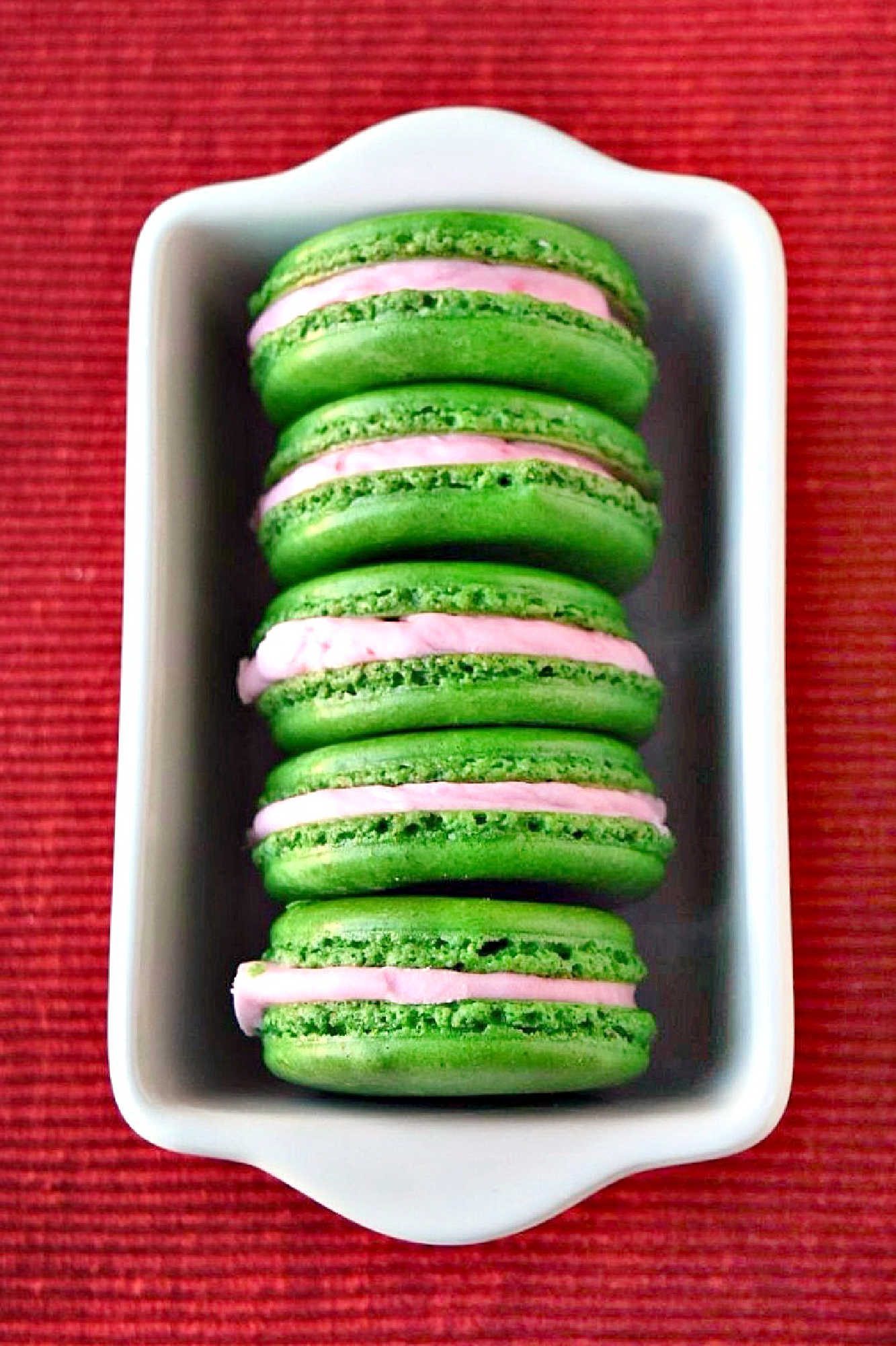Enjoy the Pistachio Cranberry Macaron, where traditional French pastry meets the vibrant flavors of pistachio and cranberry. Each bite offers a wonderful mix of chewy texture and refreshing taste, perfect for any dessert table. #ChristmasCookies #macaron #cranberry #pistachio #MacaronMadness #PistachioLove #CranberryCravings #SweetTreats #FrenchPastryFaves