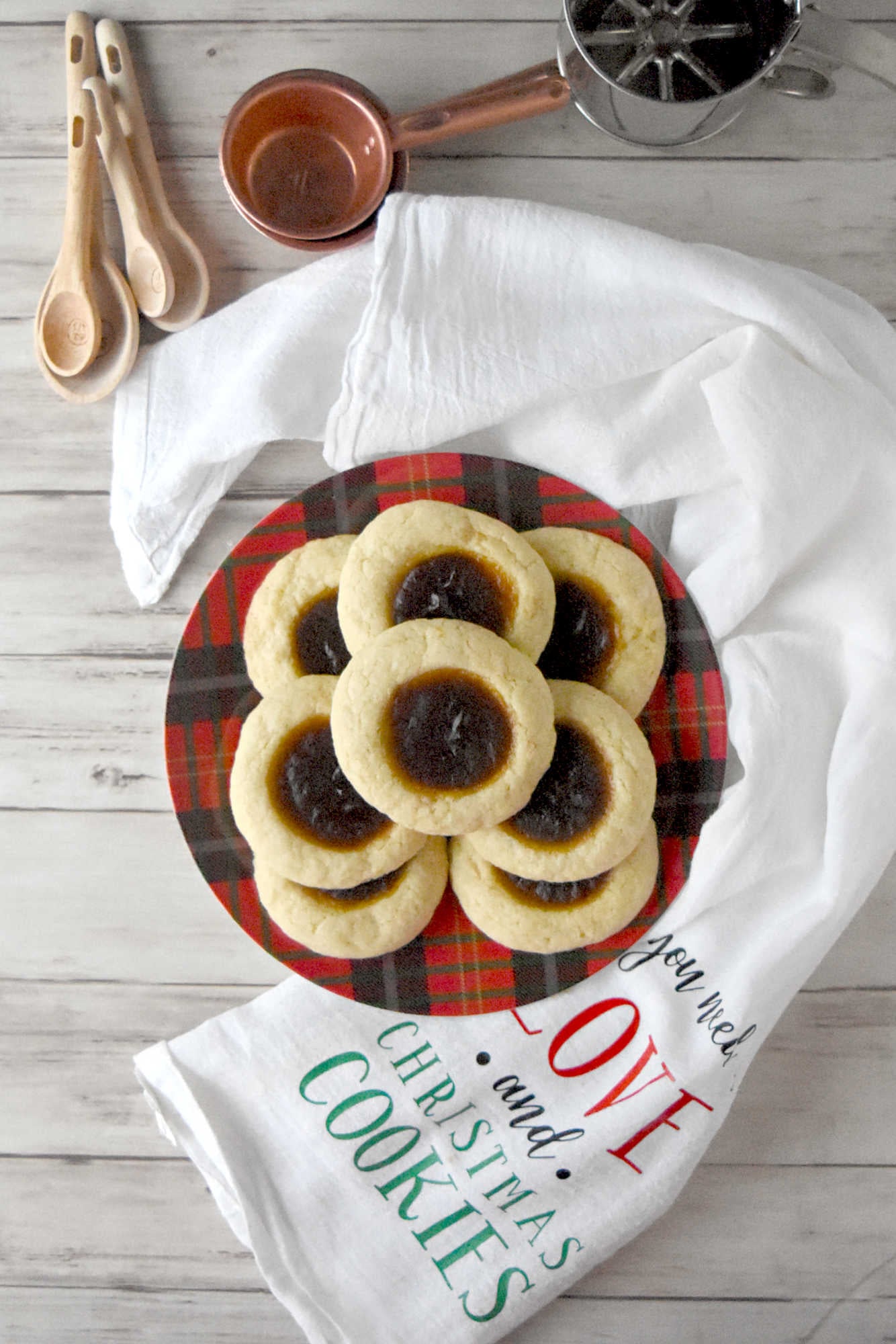 Pumpkin Pie Thumbprint Cookies take everything you love about holiday desserts and pack it into a sweet, bite sized treat.  They are perfect for anyone who cannot decide between pie and cookies. #ChristmasCookies #PumpkinPieThumbprintCookies #FallBakingDelights #HolidayBakingGoals #CookieLoversUnite #EasyDessertRecipes