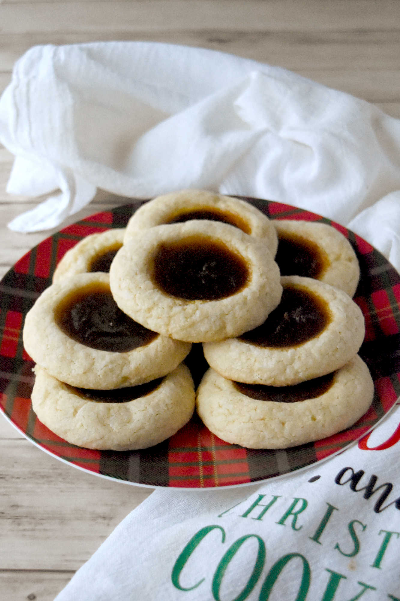 Pumpkin Pie Thumbprint Cookies take everything you love about holiday desserts and pack it into a sweet, bite sized treat.  They are perfect for anyone who cannot decide between pie and cookies. #ChristmasCookies #PumpkinPieThumbprintCookies #FallBakingDelights #HolidayBakingGoals #CookieLoversUnite #EasyDessertRecipes