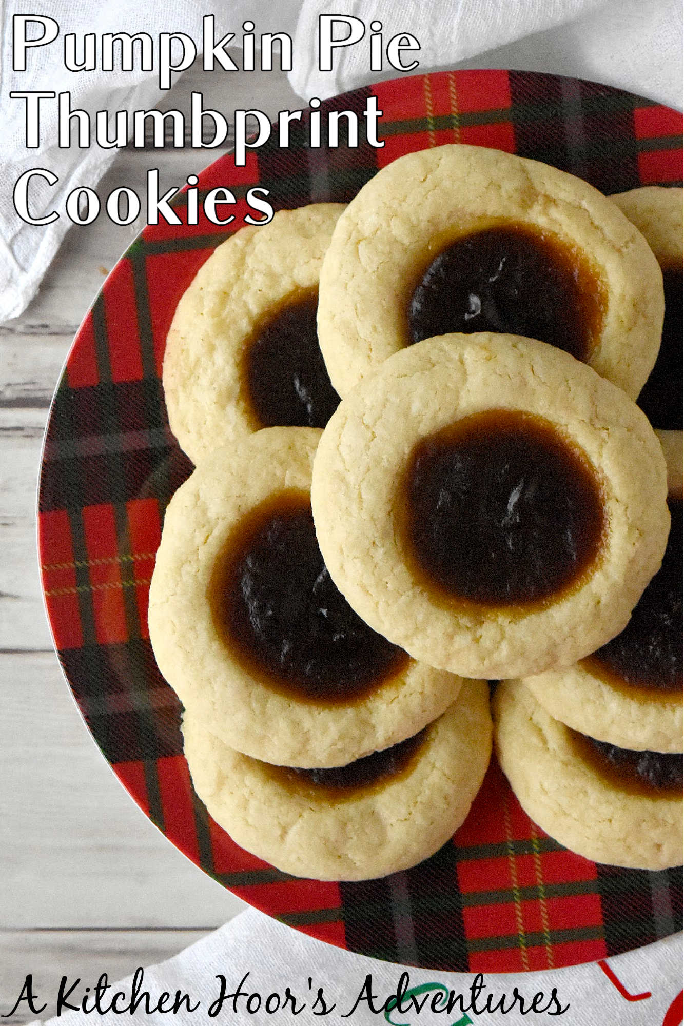 Pumpkin Pie Thumbprint Cookies take everything you love about holiday desserts and pack it into a sweet, bite sized treat.  They are perfect for anyone who cannot decide between pie and cookies. #ChristmasCookies #PumpkinPieThumbprintCookies #FallBakingDelights #HolidayBakingGoals #CookieLoversUnite #EasyDessertRecipes
