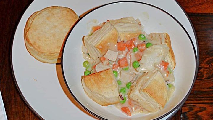 Chicken Pot Pie just got easier with this easy skillet version made with homemade gravy, shredded chicken breast, and refrigerated biscuits!