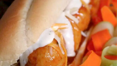 Taste buds will love these juicy baked Buffalo chicken meal subs topped with more Buffalo sauce and melty cheese. But are you picking ranch or blue cheese dressing?