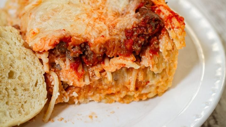 Easy baked spaghetti made with tender noodles, rich meat sauce, and melty cheese—perfect for busy weeknights, potlucks, and make-ahead family dinners.