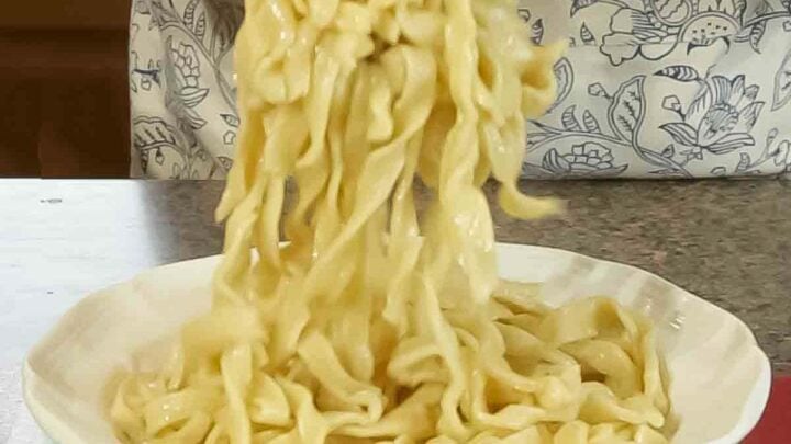 Homemade Egg Noodles in Chicken Broth are a rich and flavorful holiday side or special treat any time. Grandma's recipe!