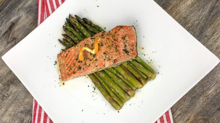 This Orange Glazed Salmon with Asparagus Recipe is a quick and easy one pan dinner that's the perfect healthy weeknight meal.