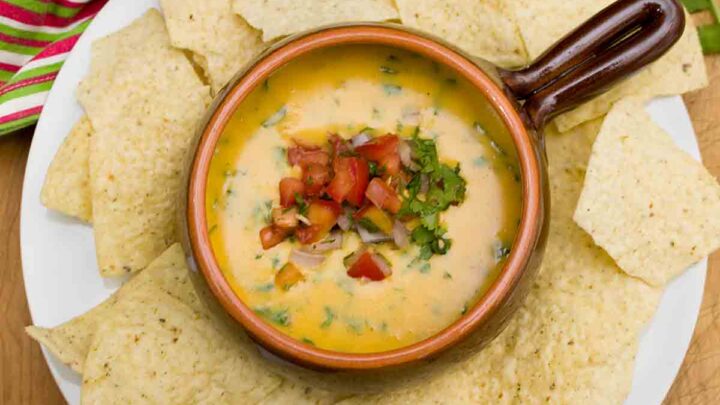 Ready in about 15 minutes, this easy Queso Dip is a tasty appetizer or snack.  Perfect for Game Day, Cinco de Mayo or any occasion!