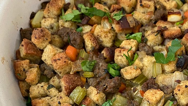 A family favorite recipe for the holidays, this Homemade Sausage and Herb Stuffing uses store-bought bread cubes, spicy sausage, vegetables,
