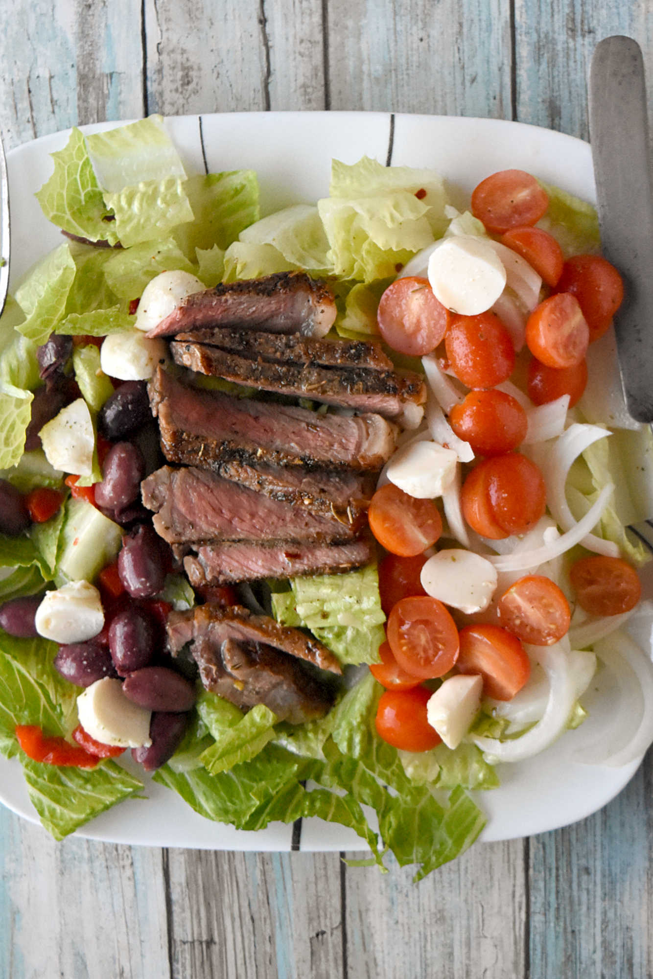 Healthy eating doesn't have to be boring. With steak Caprese salad, you blend freshness and protein into a dish that feels like a treat after a long day. #OurFamilyTable #SteakCapreseSalad #SaladLoversUnite #FoodieFinds #GourmetGrub #Foodie #ItalianDelight #SteakCapreseSalad #SteakLovers #HealthyEats #FoodieFavs #SummerSaladSensation #ResolutionRecipe