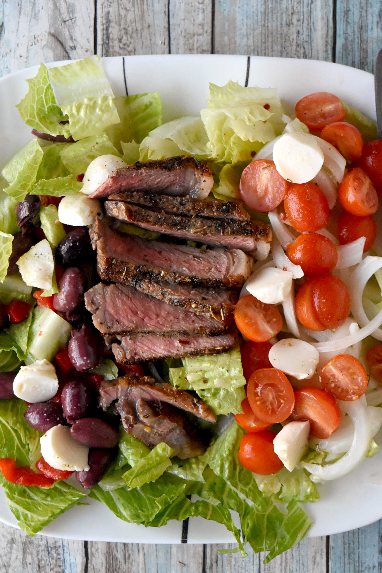 Healthy eating doesn't have to be boring. With steak Caprese salad, you blend freshness and protein into a dish that feels like a treat after a long day. #OurFamilyTable #SteakCapreseSalad #SaladLoversUnite #FoodieFinds #GourmetGrub #Foodie #ItalianDelight #SteakCapreseSalad #SteakLovers #HealthyEats #FoodieFavs #SummerSaladSensation #ResolutionRecipe