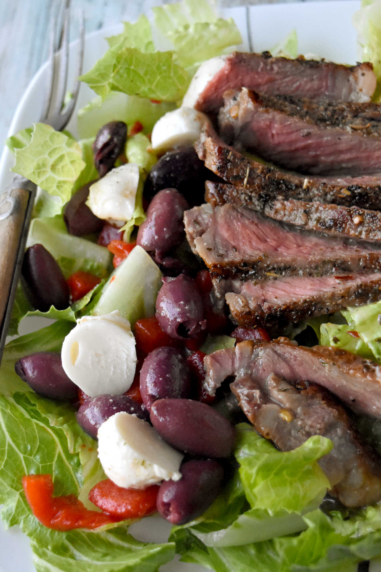 Healthy eating doesn't have to be boring. With steak Caprese salad, you blend freshness and protein into a dish that feels like a treat after a long day. #OurFamilyTable #SteakCapreseSalad #SaladLoversUnite #FoodieFinds #GourmetGrub #Foodie #ItalianDelight #SteakCapreseSalad #SteakLovers #HealthyEats #FoodieFavs #SummerSaladSensation #ResolutionRecipe