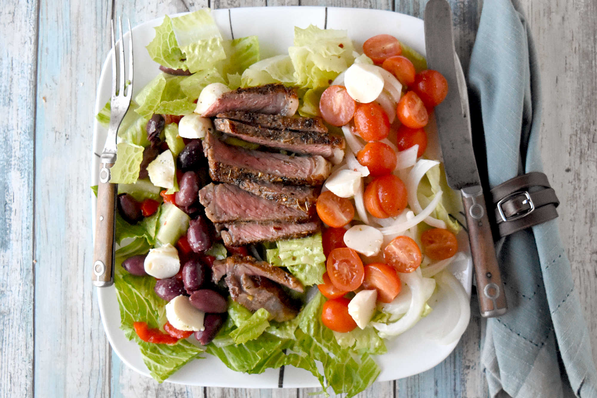 Healthy eating doesn't have to be boring. With steak Caprese salad, you blend freshness and protein into a dish that feels like a treat after a long day. #OurFamilyTable #SteakCapreseSalad #SaladLoversUnite #FoodieFinds #GourmetGrub #Foodie #ItalianDelight #SteakCapreseSalad #SteakLovers #HealthyEats #FoodieFavs #SummerSaladSensation #ResolutionRecipe
