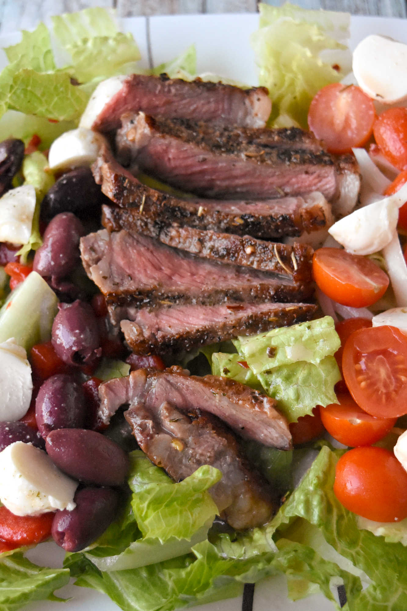 Healthy eating doesn't have to be boring. With steak Caprese salad, you blend freshness and protein into a dish that feels like a treat after a long day. #OurFamilyTable #SteakCapreseSalad #SaladLoversUnite #FoodieFinds #GourmetGrub #Foodie #ItalianDelight #SteakCapreseSalad #SteakLovers #HealthyEats #FoodieFavs #SummerSaladSensation #ResolutionRecipe