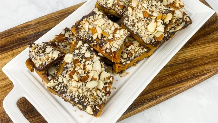Classic almond buttercrunch candy layered with rich chocolate and toasted almonds. A perfect homemade holiday gift or sweet treat for celebrations.