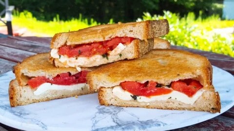 Discover the ultimate summer sandwich! Enjoy beautiful heirloom tomatoes, fresh mozzarella, locally made bread, and fragrant basil in every bite!