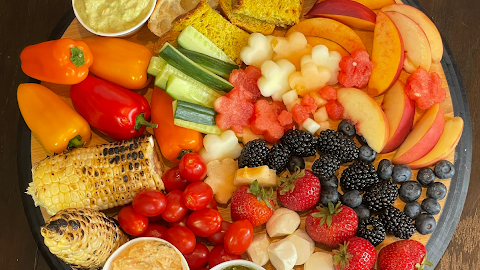 Charcuterie boards make any dinner or BBQ complete and this summer charcuterie board is based on the fresh produce of this season. This season is filled with varieties of melons, berries, stone fruits, cucurbits, corn, and many other veggies.....tomato of course.