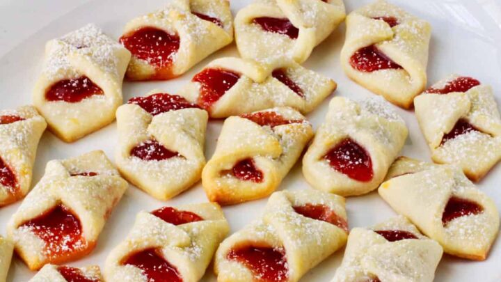 Welcome spring with these bow tie cookies with strawberry jam. They are little poppable tasty treats. Everyone will be eating these one after another after another. 