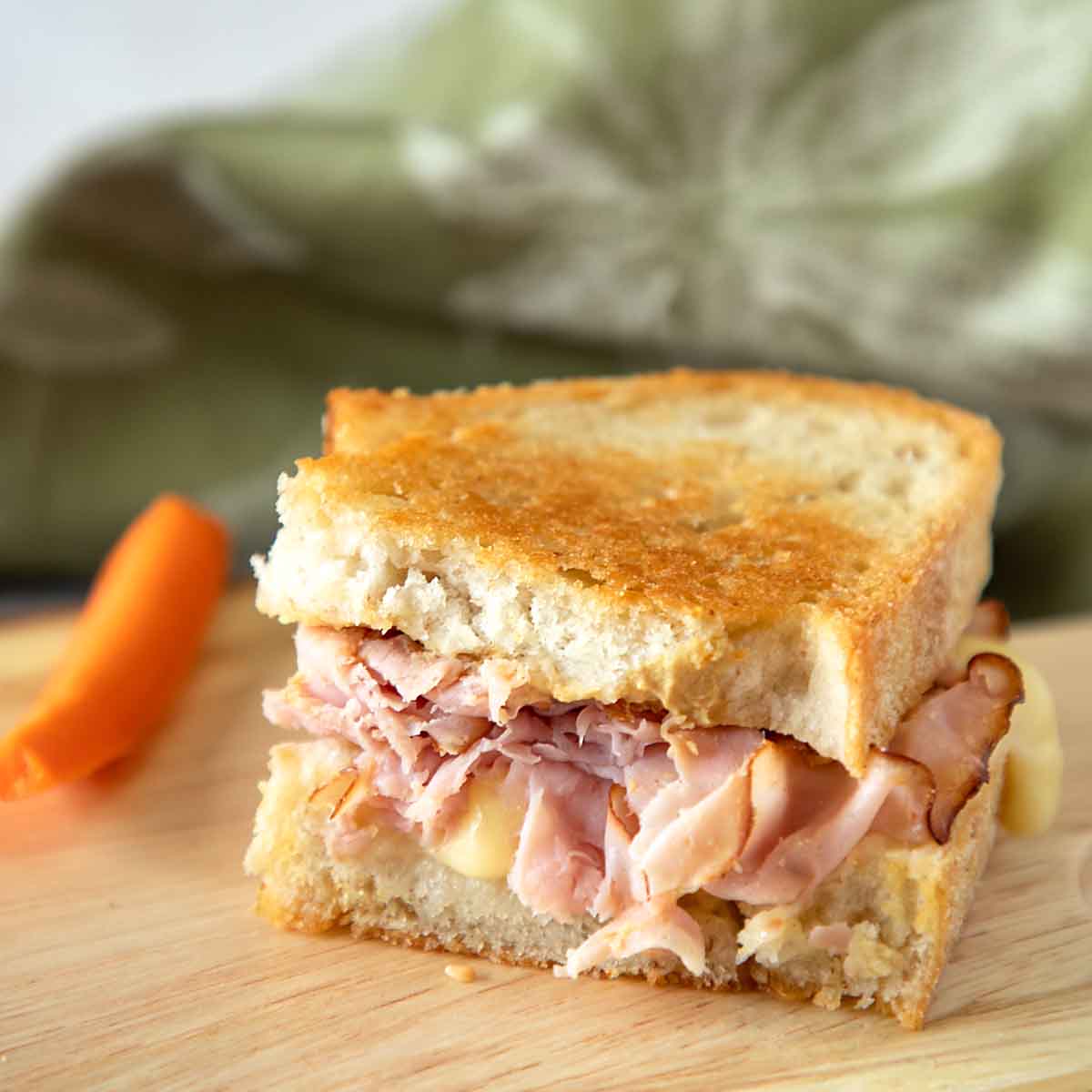 With savory ham, creamy cheese and a bit of mustard, a Grilled Ham and Cheese Sandwich is classic comfort food for a family friendly lunch.
