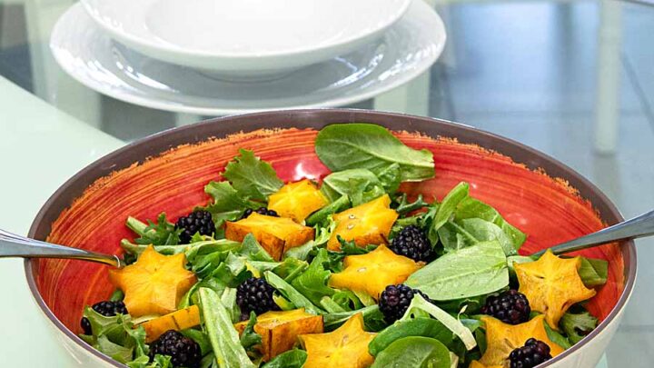 Blackberries, starfruit and salad greens pair with fresh passionfruit dressing in this tasty Moon and Starfruit Tropical Salad.