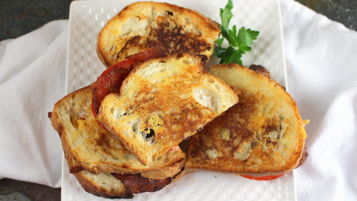 Bacon Tomato Grilled Cheese combines the best parts of a BLT and a grilled cheese in one delicious toasted sandwich on sourdough bread.