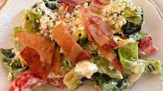 This delicious chopped salad with homemade creamy herb dressing is the perfect start to a meal or addition to a brunch buffet.  You can serve the bacon and blue cheese separately so people can add them according to their tastes.