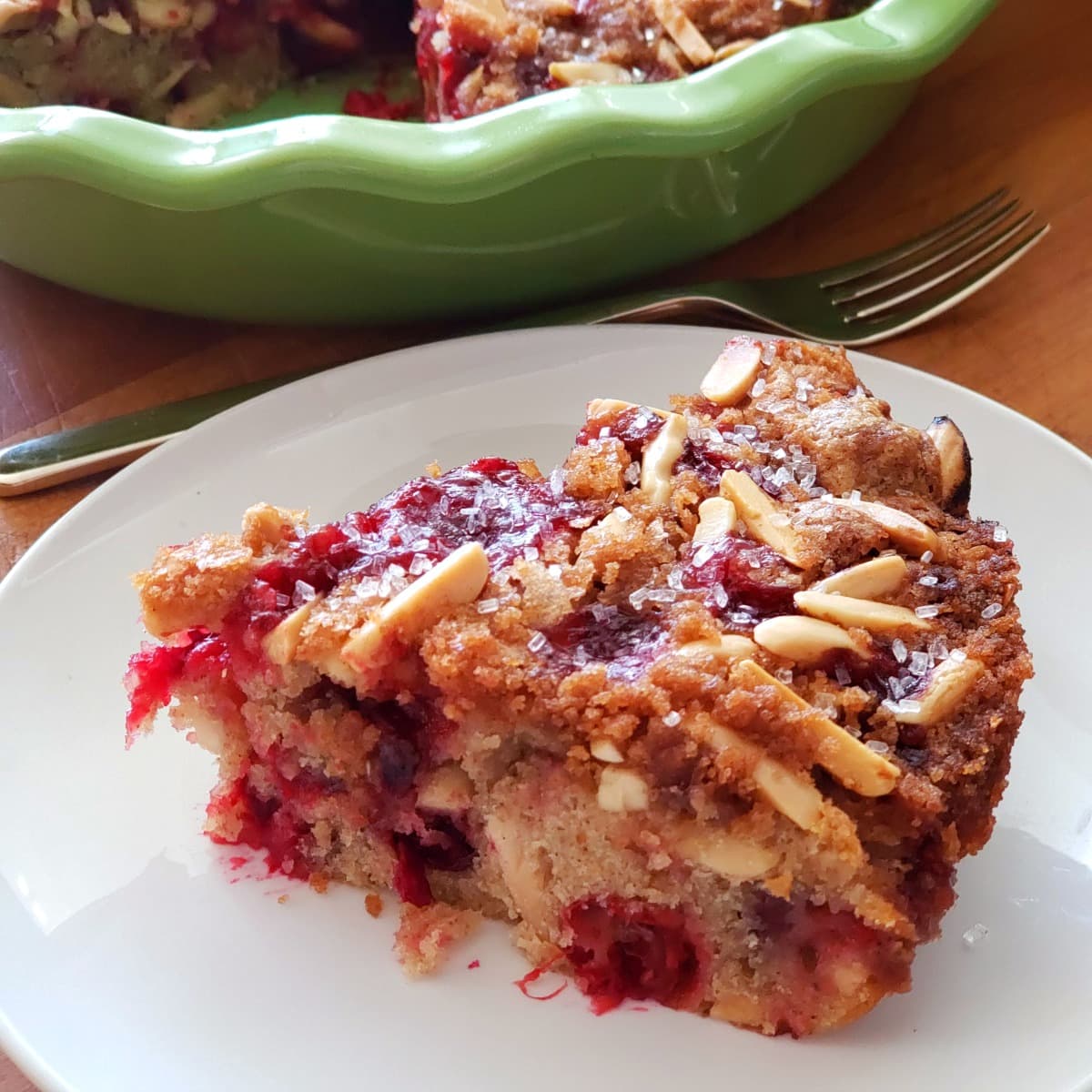 Cranberry Breakfast Cake bakes up like a dream, with tart berries in a lightly sweet almond-scented cake, topped with nutty streusel.