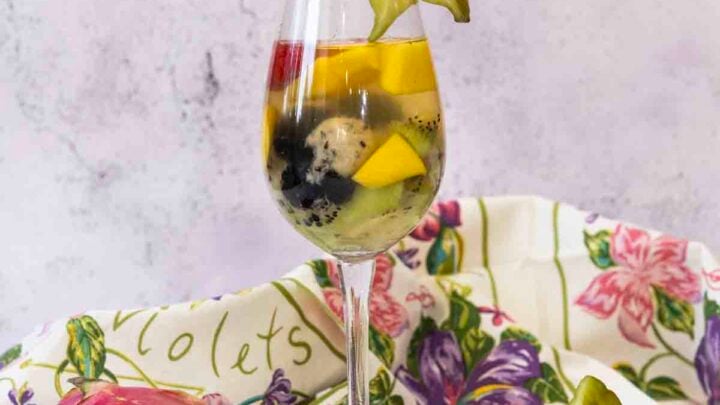 With flavors of coconut, rum & orange, plus lots of exotic fruit, this Tropical Sangria is a tasty and & summer white wine cocktail.