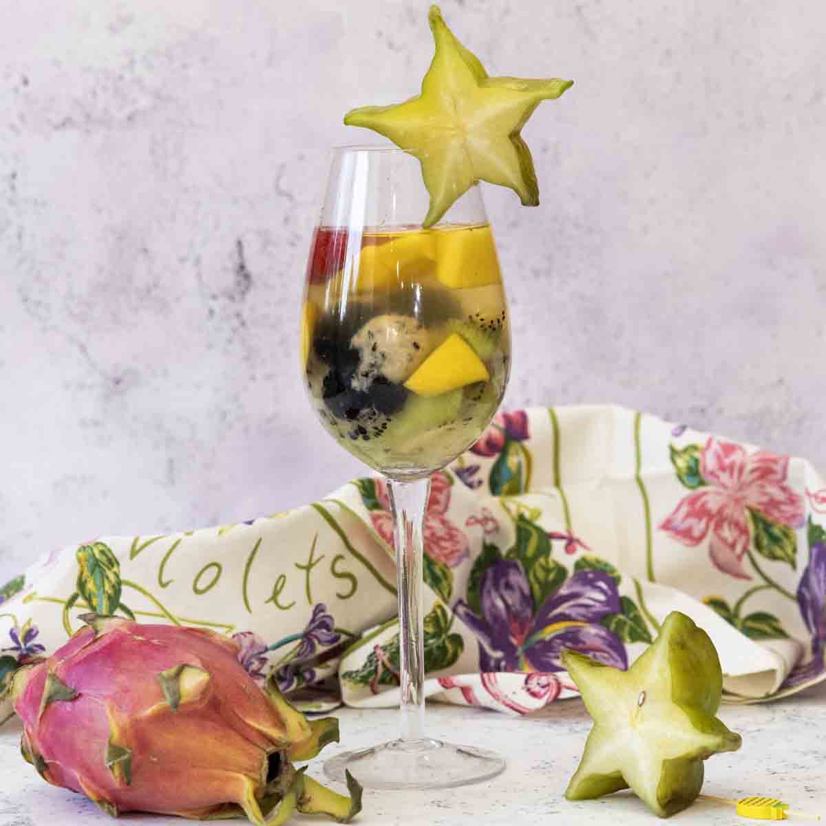 With flavors of coconut, rum & orange, plus lots of exotic fruit, this Tropical Sangria is a tasty and & summer white wine cocktail.