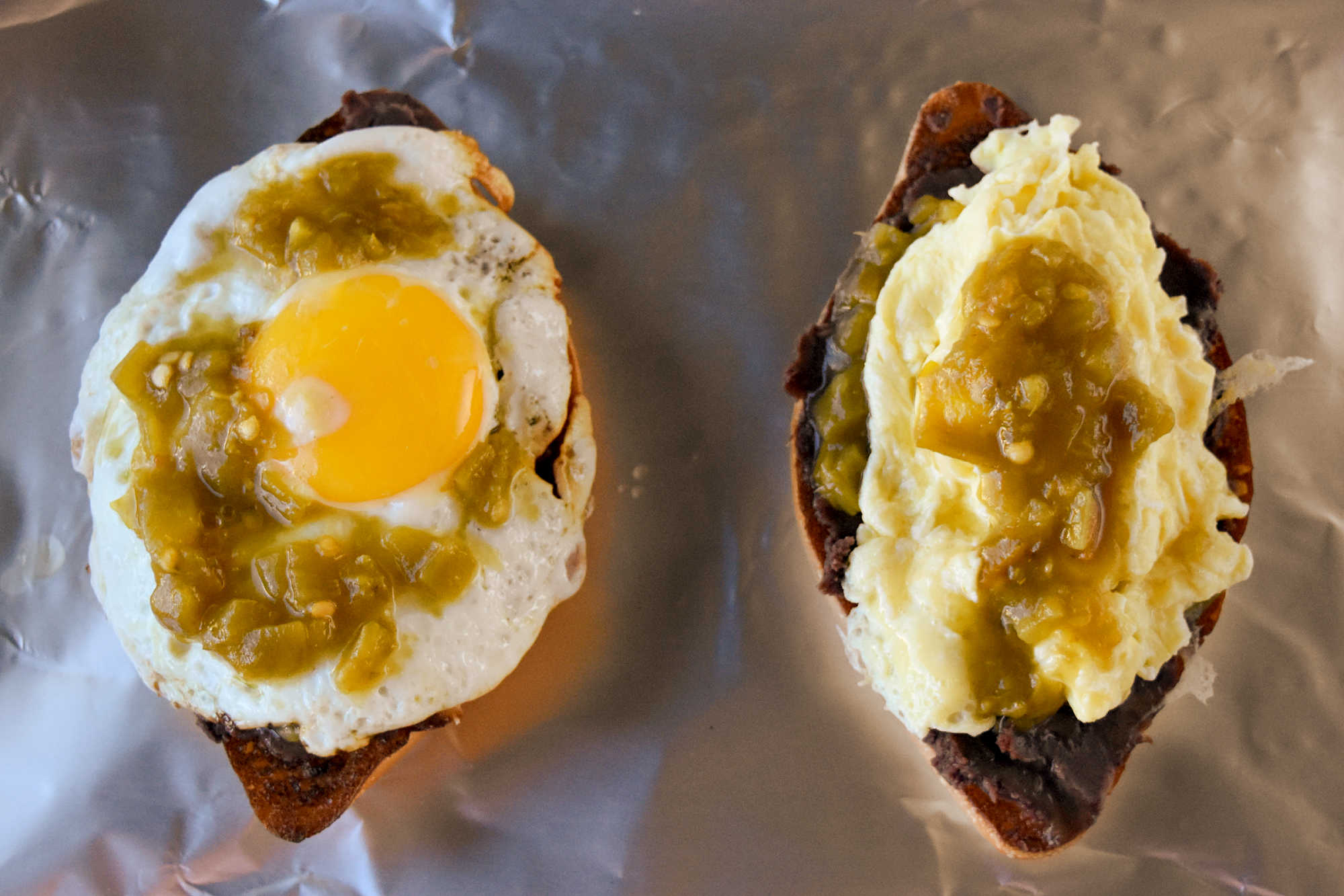 Experience the perfect blend of eggs and spicy green chiles in every bite of these mouthwatering molletes. Whether you're hosting a brunch or treating yourself on Mother's Day, this recipe is sure to impress. Don't wait any longer - unleash the flavor explosion today!
 
Looking for a new brunch favorite or a satisfying snack? Egg and green chile molletes are the answer! This simple yet delicious dish brings together warm bread, crispy eggs, and zesty green chiles for a meal that’s both comforting and exciting. Whether you’re a seasoned cook or just starting out, molletes are sure to become a staple in your kitchen.
 
What Are Molletes?
 
Molletes are a traditional Mexican open-faced sandwich.  They’re typically made by topping sliced bread with refried beans and cheese, then baking until golden and bubbly. Our version adds a flavorful twist by including crispy fried eggs topped with green chiles, enhancing both texture and taste. Molletes are loved for their versatility and ability to satisfy cravings any time of day.
 
P2V
 
This dish has roots in Mexican culinary traditions, dating back to colonial times when bread became a staple. Molletes were originally a way to use up leftover bread and beans, turning simple ingredients into a comforting meal. Over time, molletes have evolved, reflecting regional tastes and creative adaptations. Today, they’re enjoyed across Mexico and beyond, celebrated for their ease and flavor.
 
Basic Molletes Ingredients
 
To make egg and green chile molletes, you’ll need these essentials:
Bread (bolillo, baguette, or other crusty loaf)
Eggs
Green chiles (fresh or canned)
Refried beans
Cheese (such as Monterey Jack or queso fresco)
Butter or oil
Salt and pepper
 
P3H
 
Gather Your Ingredients
 
Choose a sturdy bread that holds up well to toppings. Bollilos are oval-shaped Mexican rolls with a crisp golden crust and a soft, airy interior, perfect for holding hearty toppings.  For green chiles, canned varieties work in a pinch, but fresh roasted chiles will add extra depth. Make sure your eggs are fresh and select a melty cheese for that signature gooey finish. I like a Colby or pepper jack.  Sometimes I opt for a quesadilla cheese which is super cheesy and delicious.  Prepping all ingredients beforehand makes assembly easy and stress-free.
 
Customizing Your Molletes
 
Molletes are wonderfully adaptable. Change up the cheese to one you like.  Melty and delicious like a cheddar or sprinkle some Oaxaca on top.  Level up the protein and add cooked sausage or bacon.  Finally, sprinkle the finished dish with fresh cilantro or sliced green onions for extra flavor. Up the veggies and add sautéed mushrooms or onions. Spice lovers can use hotter chiles or add a dash of hot sauce.
 
P4V
 
Type of Bread Used for Molletes
 
Bolillo rolls are the traditional choice.  They are known for their crisp crust and soft interior. If you can’t find bolillos, try using a baguette.  Or you can grab ciabatta loaf or roll.  You can even try sourdough or French bread.  I’ve made plenty of French bread pizzas and know it will stand up to all the toppings.  The key is finding bread that won’t get soggy and offers a sturdy base for your toppings.
 
Prep Your Bread
 
Slice your bread in half lengthwise and lightly toast it to help create a crunchy foundation. You can brush the cut sides with butter for added richness before toasting under the broiler or in a toaster oven.  If you’re toasting it in the broiler, make sure to keep an eye on it.  It will burn faster than you think.  I’m talking seconds.  So, don’t let it go unattended.
 
P5V
 
Cook the Eggs and Green Chiles
 
Cook your eggs in a skillet.  I made some crispy edged fried eggs.  I like mine well done.  But you can make them over easy or even sunny side up if you want.  Or you can scramble them.  If you opt for scrambled you can stir in the diced green chiles. 
 
If you’re going to scramble them, aim for soft, creamy eggs so they stay moist when assembled with the other ingredients.  Gently whisk your eggs and cook them over low heat.  Stir continuously to create small, creamy curds. Remove the eggs from the heat just before they’re fully set to ensure they stay tender and moist, perfect for topping molletes.
 
P6H
 
Assemble Your Molletes
 
Spread a generous layer of refried beans on each toasted bread half. There are several types to choose from.  I like black refried beans.  They’re rich and delicious.  But you can find pinto and Peruvian beans.  Or you can make your own out of any type of bean you want.  Top with the fried egg (or scrambled) and then some green chiles.  Next, sprinkle with cheese. Finally, return to the oven until the cheese melts and bubbles. Serve warm garnished with cilantro or sliced green onions and a dash of cholula sauce for an added kick.
 
For a Mother’s Day brunch, serve these molletes family-style on a big platter so everyone can grab a warm, melty piece. Have a toppings bar so they can finish their own with fresh toppings like sliced avocado, pico de gallo, cilantro, or a drizzle of your favorite hot sauce.
 
P7V
 
They pair beautifully with a bright fruit salad (think berries, melon, and citrus) or a simple green salad with a lime vinaigrette.  You can also serve them with some patatas bravas, or crispy and spicy breakfast potatoes to round out the meal. I’m fond a creamy, homemade guacamole to dallop on top.  For drinks, try serving it with an agua fresca or sparkling water with grapefruit and mint.  Or for a luscious libation a delicious michelada, mimosa or a paloma with grapefruit soda and tequila.  They add a festive touch and pair beautifully with the bold flavors of molletes.
 
Enjoy Your Flavorful Creation
 
Fried egg and green chile molletes are a vibrant Mexican-inspired breakfast dish, featuring crispy-edged fried eggs nestled atop toasted bread halves generously layered with rich refried beans. The eggs are topped with diced green chiles, adding a mild heat and zesty flavor that perfectly complements the creamy beans. Finished with a sprinkle of cheese and melted until bubbly, these molletes offer a satisfying combination of savory, spicy, and cheesy elements in every bite, making them an irresistible option for brunch or a special occasion.
 
P8H
 
If you’re looking to round out your Mother’s Day brunch spread with more Latin American flavors, consider serving sweet and savory treats.  Serve these with some Mexican chilaquiles consist of crispy tortilla chips simmered in salsa and topped with crema and queso fresco.   Or try these with some Argentinian medialunas, which are buttery crescent rolls that are perfect for pairing with coffee. Finally, Colombian arepas.  They are lightly grilled and filled with cheese or eggs, making them a delightful addition alongside molletes.
 
You could also add Brazilian pão de queijo.  They’re soft and chewy cheese breads that re addictive!  Or try a Peruvian fruit salad with passion fruit and mango for a refreshing touch.  These molletes would be perfect paired with sweet or savory empanadas, too.