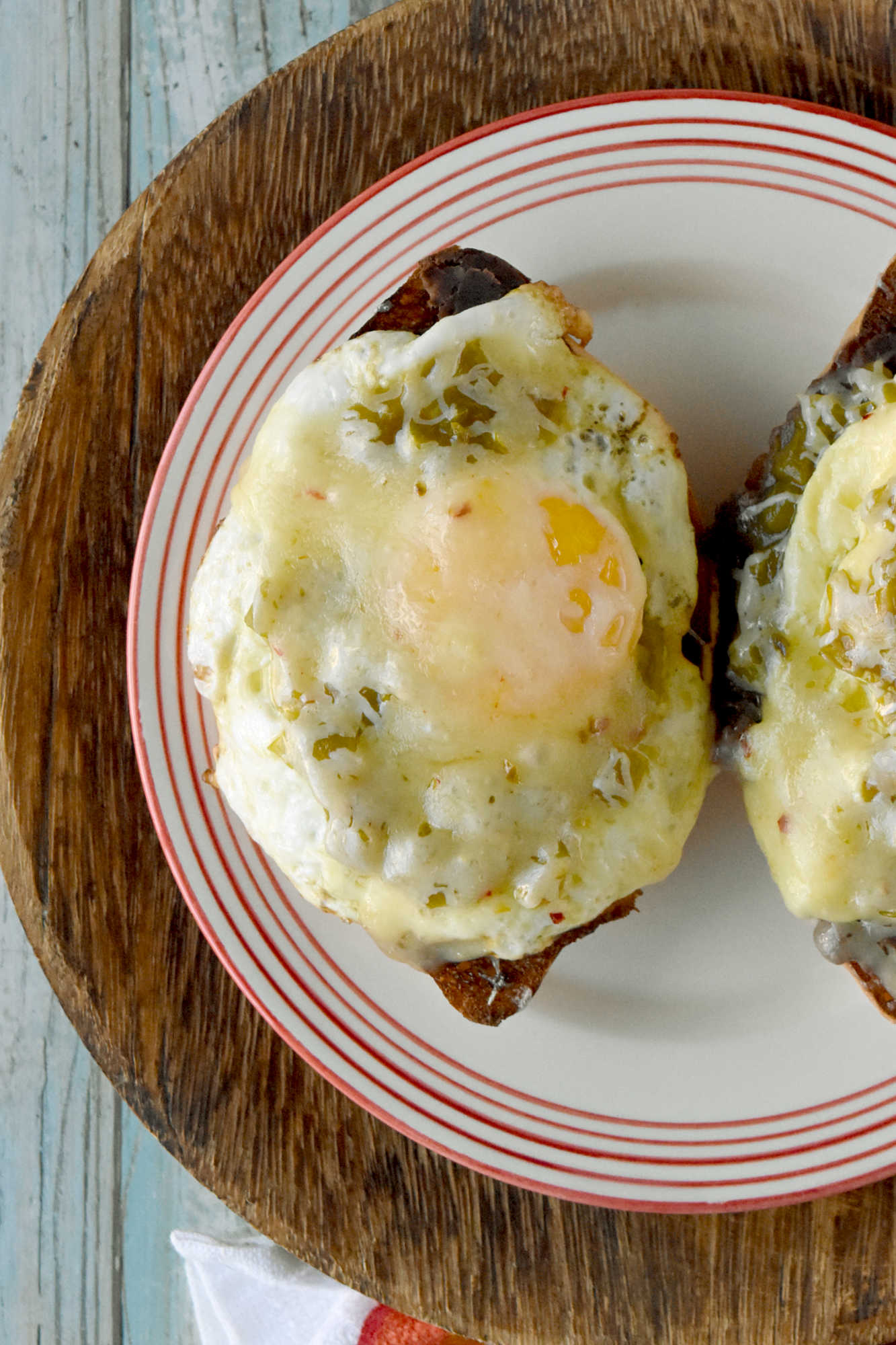 Experience the perfect blend of eggs and spicy green chiles in every bite of these mouthwatering molletes. Whether you're hosting a brunch or treating yourself on Mother's Day, this recipe is sure to impress. Don't wait any longer - unleash the flavor explosion today!
 
Looking for a new brunch favorite or a satisfying snack? Egg and green chile molletes are the answer! This simple yet delicious dish brings together warm bread, crispy eggs, and zesty green chiles for a meal that’s both comforting and exciting. Whether you’re a seasoned cook or just starting out, molletes are sure to become a staple in your kitchen.
 
What Are Molletes?
 
Molletes are a traditional Mexican open-faced sandwich.  They’re typically made by topping sliced bread with refried beans and cheese, then baking until golden and bubbly. Our version adds a flavorful twist by including crispy fried eggs topped with green chiles, enhancing both texture and taste. Molletes are loved for their versatility and ability to satisfy cravings any time of day.
 
P2V
 
This dish has roots in Mexican culinary traditions, dating back to colonial times when bread became a staple. Molletes were originally a way to use up leftover bread and beans, turning simple ingredients into a comforting meal. Over time, molletes have evolved, reflecting regional tastes and creative adaptations. Today, they’re enjoyed across Mexico and beyond, celebrated for their ease and flavor.
 
Basic Molletes Ingredients
 
To make egg and green chile molletes, you’ll need these essentials:
Bread (bolillo, baguette, or other crusty loaf)
Eggs
Green chiles (fresh or canned)
Refried beans
Cheese (such as Monterey Jack or queso fresco)
Butter or oil
Salt and pepper
 
P3H
 
Gather Your Ingredients
 
Choose a sturdy bread that holds up well to toppings. Bollilos are oval-shaped Mexican rolls with a crisp golden crust and a soft, airy interior, perfect for holding hearty toppings.  For green chiles, canned varieties work in a pinch, but fresh roasted chiles will add extra depth. Make sure your eggs are fresh and select a melty cheese for that signature gooey finish. I like a Colby or pepper jack.  Sometimes I opt for a quesadilla cheese which is super cheesy and delicious.  Prepping all ingredients beforehand makes assembly easy and stress-free.
 
Customizing Your Molletes
 
Molletes are wonderfully adaptable. Change up the cheese to one you like.  Melty and delicious like a cheddar or sprinkle some Oaxaca on top.  Level up the protein and add cooked sausage or bacon.  Finally, sprinkle the finished dish with fresh cilantro or sliced green onions for extra flavor. Up the veggies and add sautéed mushrooms or onions. Spice lovers can use hotter chiles or add a dash of hot sauce.
 
P4V
 
Type of Bread Used for Molletes
 
Bolillo rolls are the traditional choice.  They are known for their crisp crust and soft interior. If you can’t find bolillos, try using a baguette.  Or you can grab ciabatta loaf or roll.  You can even try sourdough or French bread.  I’ve made plenty of French bread pizzas and know it will stand up to all the toppings.  The key is finding bread that won’t get soggy and offers a sturdy base for your toppings.
 
Prep Your Bread
 
Slice your bread in half lengthwise and lightly toast it to help create a crunchy foundation. You can brush the cut sides with butter for added richness before toasting under the broiler or in a toaster oven.  If you’re toasting it in the broiler, make sure to keep an eye on it.  It will burn faster than you think.  I’m talking seconds.  So, don’t let it go unattended.
 
P5V
 
Cook the Eggs and Green Chiles
 
Cook your eggs in a skillet.  I made some crispy edged fried eggs.  I like mine well done.  But you can make them over easy or even sunny side up if you want.  Or you can scramble them.  If you opt for scrambled you can stir in the diced green chiles. 
 
If you’re going to scramble them, aim for soft, creamy eggs so they stay moist when assembled with the other ingredients.  Gently whisk your eggs and cook them over low heat.  Stir continuously to create small, creamy curds. Remove the eggs from the heat just before they’re fully set to ensure they stay tender and moist, perfect for topping molletes.
 
P6H
 
Assemble Your Molletes
 
Spread a generous layer of refried beans on each toasted bread half. There are several types to choose from.  I like black refried beans.  They’re rich and delicious.  But you can find pinto and Peruvian beans.  Or you can make your own out of any type of bean you want.  Top with the fried egg (or scrambled) and then some green chiles.  Next, sprinkle with cheese. Finally, return to the oven until the cheese melts and bubbles. Serve warm garnished with cilantro or sliced green onions and a dash of cholula sauce for an added kick.
 
For a Mother’s Day brunch, serve these molletes family-style on a big platter so everyone can grab a warm, melty piece. Have a toppings bar so they can finish their own with fresh toppings like sliced avocado, pico de gallo, cilantro, or a drizzle of your favorite hot sauce.
 
P7V
 
They pair beautifully with a bright fruit salad (think berries, melon, and citrus) or a simple green salad with a lime vinaigrette.  You can also serve them with some patatas bravas, or crispy and spicy breakfast potatoes to round out the meal. I’m fond a creamy, homemade guacamole to dallop on top.  For drinks, try serving it with an agua fresca or sparkling water with grapefruit and mint.  Or for a luscious libation a delicious michelada, mimosa or a paloma with grapefruit soda and tequila.  They add a festive touch and pair beautifully with the bold flavors of molletes.
 
Enjoy Your Flavorful Creation
 
Fried egg and green chile molletes are a vibrant Mexican-inspired breakfast dish, featuring crispy-edged fried eggs nestled atop toasted bread halves generously layered with rich refried beans. The eggs are topped with diced green chiles, adding a mild heat and zesty flavor that perfectly complements the creamy beans. Finished with a sprinkle of cheese and melted until bubbly, these molletes offer a satisfying combination of savory, spicy, and cheesy elements in every bite, making them an irresistible option for brunch or a special occasion.
 
P8H
 
If you’re looking to round out your Mother’s Day brunch spread with more Latin American flavors, consider serving sweet and savory treats.  Serve these with some Mexican chilaquiles consist of crispy tortilla chips simmered in salsa and topped with crema and queso fresco.   Or try these with some Argentinian medialunas, which are buttery crescent rolls that are perfect for pairing with coffee. Finally, Colombian arepas.  They are lightly grilled and filled with cheese or eggs, making them a delightful addition alongside molletes.
 
You could also add Brazilian pão de queijo.  They’re soft and chewy cheese breads that re addictive!  Or try a Peruvian fruit salad with passion fruit and mango for a refreshing touch.  These molletes would be perfect paired with sweet or savory empanadas, too.