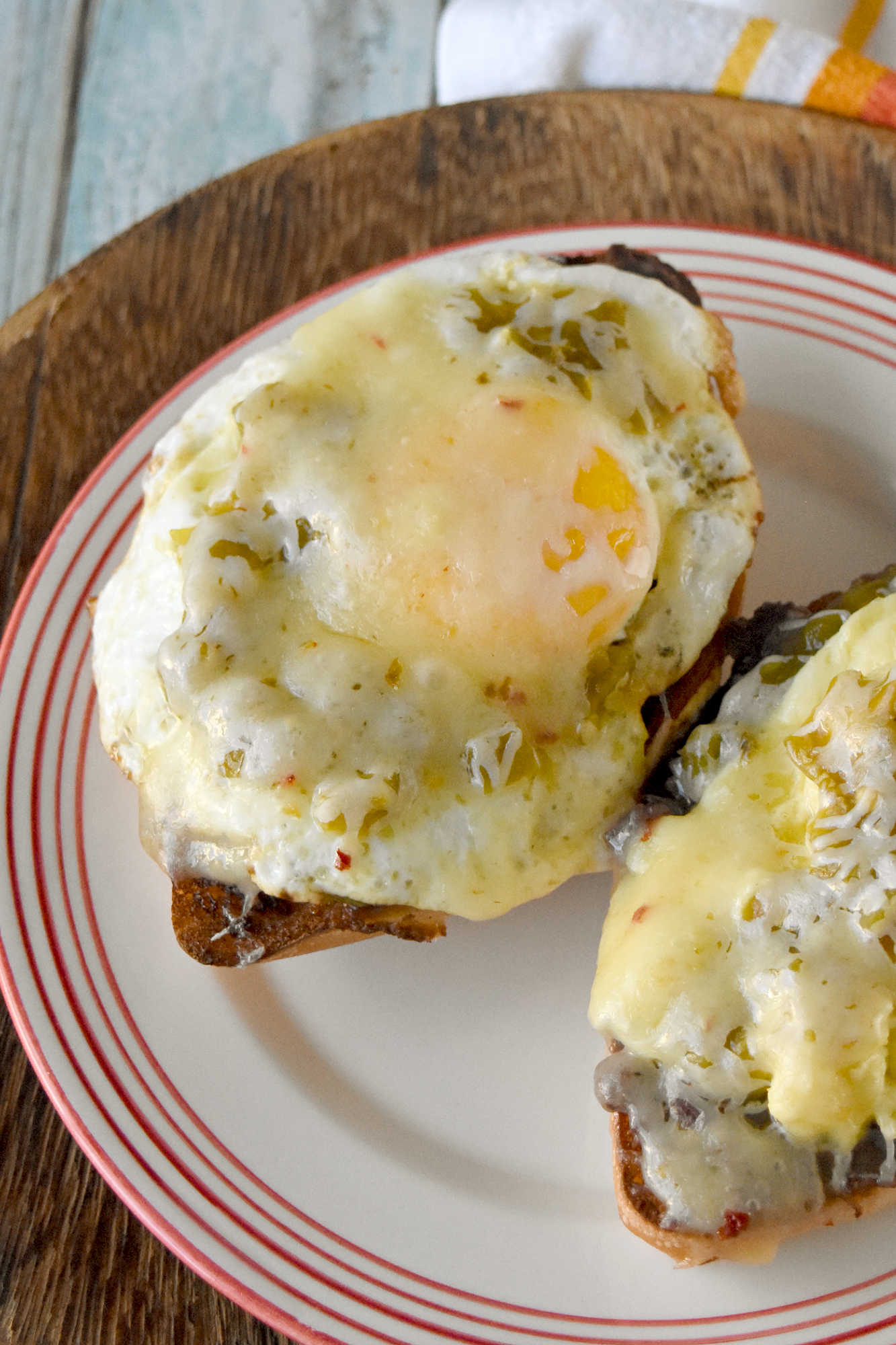 Experience the perfect blend of eggs and spicy green chiles in every bite of these mouthwatering molletes. Whether you're hosting a brunch or treating yourself on Mother's Day, this recipe is sure to impress. Don't wait any longer - unleash the flavor explosion today!
 
Looking for a new brunch favorite or a satisfying snack? Egg and green chile molletes are the answer! This simple yet delicious dish brings together warm bread, crispy eggs, and zesty green chiles for a meal that’s both comforting and exciting. Whether you’re a seasoned cook or just starting out, molletes are sure to become a staple in your kitchen.
 
What Are Molletes?
 
Molletes are a traditional Mexican open-faced sandwich.  They’re typically made by topping sliced bread with refried beans and cheese, then baking until golden and bubbly. Our version adds a flavorful twist by including crispy fried eggs topped with green chiles, enhancing both texture and taste. Molletes are loved for their versatility and ability to satisfy cravings any time of day.
 
P2V
 
This dish has roots in Mexican culinary traditions, dating back to colonial times when bread became a staple. Molletes were originally a way to use up leftover bread and beans, turning simple ingredients into a comforting meal. Over time, molletes have evolved, reflecting regional tastes and creative adaptations. Today, they’re enjoyed across Mexico and beyond, celebrated for their ease and flavor.
 
Basic Molletes Ingredients
 
To make egg and green chile molletes, you’ll need these essentials:
Bread (bolillo, baguette, or other crusty loaf)
Eggs
Green chiles (fresh or canned)
Refried beans
Cheese (such as Monterey Jack or queso fresco)
Butter or oil
Salt and pepper
 
P3H
 
Gather Your Ingredients
 
Choose a sturdy bread that holds up well to toppings. Bollilos are oval-shaped Mexican rolls with a crisp golden crust and a soft, airy interior, perfect for holding hearty toppings.  For green chiles, canned varieties work in a pinch, but fresh roasted chiles will add extra depth. Make sure your eggs are fresh and select a melty cheese for that signature gooey finish. I like a Colby or pepper jack.  Sometimes I opt for a quesadilla cheese which is super cheesy and delicious.  Prepping all ingredients beforehand makes assembly easy and stress-free.
 
Customizing Your Molletes
 
Molletes are wonderfully adaptable. Change up the cheese to one you like.  Melty and delicious like a cheddar or sprinkle some Oaxaca on top.  Level up the protein and add cooked sausage or bacon.  Finally, sprinkle the finished dish with fresh cilantro or sliced green onions for extra flavor. Up the veggies and add sautéed mushrooms or onions. Spice lovers can use hotter chiles or add a dash of hot sauce.
 
P4V
 
Type of Bread Used for Molletes
 
Bolillo rolls are the traditional choice.  They are known for their crisp crust and soft interior. If you can’t find bolillos, try using a baguette.  Or you can grab ciabatta loaf or roll.  You can even try sourdough or French bread.  I’ve made plenty of French bread pizzas and know it will stand up to all the toppings.  The key is finding bread that won’t get soggy and offers a sturdy base for your toppings.
 
Prep Your Bread
 
Slice your bread in half lengthwise and lightly toast it to help create a crunchy foundation. You can brush the cut sides with butter for added richness before toasting under the broiler or in a toaster oven.  If you’re toasting it in the broiler, make sure to keep an eye on it.  It will burn faster than you think.  I’m talking seconds.  So, don’t let it go unattended.
 
P5V
 
Cook the Eggs and Green Chiles
 
Cook your eggs in a skillet.  I made some crispy edged fried eggs.  I like mine well done.  But you can make them over easy or even sunny side up if you want.  Or you can scramble them.  If you opt for scrambled you can stir in the diced green chiles. 
 
If you’re going to scramble them, aim for soft, creamy eggs so they stay moist when assembled with the other ingredients.  Gently whisk your eggs and cook them over low heat.  Stir continuously to create small, creamy curds. Remove the eggs from the heat just before they’re fully set to ensure they stay tender and moist, perfect for topping molletes.
 
P6H
 
Assemble Your Molletes
 
Spread a generous layer of refried beans on each toasted bread half. There are several types to choose from.  I like black refried beans.  They’re rich and delicious.  But you can find pinto and Peruvian beans.  Or you can make your own out of any type of bean you want.  Top with the fried egg (or scrambled) and then some green chiles.  Next, sprinkle with cheese. Finally, return to the oven until the cheese melts and bubbles. Serve warm garnished with cilantro or sliced green onions and a dash of cholula sauce for an added kick.
 
For a Mother’s Day brunch, serve these molletes family-style on a big platter so everyone can grab a warm, melty piece. Have a toppings bar so they can finish their own with fresh toppings like sliced avocado, pico de gallo, cilantro, or a drizzle of your favorite hot sauce.
 
P7V
 
They pair beautifully with a bright fruit salad (think berries, melon, and citrus) or a simple green salad with a lime vinaigrette.  You can also serve them with some patatas bravas, or crispy and spicy breakfast potatoes to round out the meal. I’m fond a creamy, homemade guacamole to dallop on top.  For drinks, try serving it with an agua fresca or sparkling water with grapefruit and mint.  Or for a luscious libation a delicious michelada, mimosa or a paloma with grapefruit soda and tequila.  They add a festive touch and pair beautifully with the bold flavors of molletes.
 
Enjoy Your Flavorful Creation
 
Fried egg and green chile molletes are a vibrant Mexican-inspired breakfast dish, featuring crispy-edged fried eggs nestled atop toasted bread halves generously layered with rich refried beans. The eggs are topped with diced green chiles, adding a mild heat and zesty flavor that perfectly complements the creamy beans. Finished with a sprinkle of cheese and melted until bubbly, these molletes offer a satisfying combination of savory, spicy, and cheesy elements in every bite, making them an irresistible option for brunch or a special occasion.
 
P8H
 
If you’re looking to round out your Mother’s Day brunch spread with more Latin American flavors, consider serving sweet and savory treats.  Serve these with some Mexican chilaquiles consist of crispy tortilla chips simmered in salsa and topped with crema and queso fresco.   Or try these with some Argentinian medialunas, which are buttery crescent rolls that are perfect for pairing with coffee. Finally, Colombian arepas.  They are lightly grilled and filled with cheese or eggs, making them a delightful addition alongside molletes.
 
You could also add Brazilian pão de queijo.  They’re soft and chewy cheese breads that re addictive!  Or try a Peruvian fruit salad with passion fruit and mango for a refreshing touch.  These molletes would be perfect paired with sweet or savory empanadas, too.