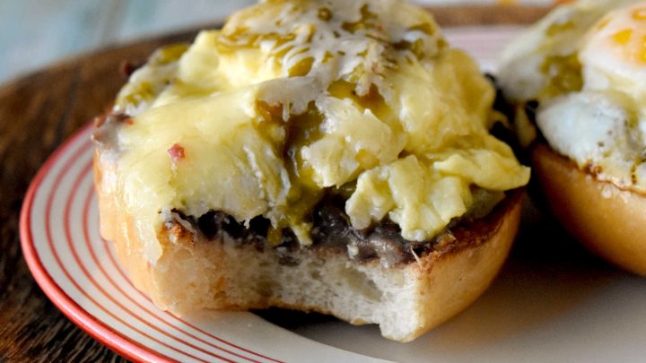 Experience the perfect blend of eggs and spicy green chiles in every bite of these mouthwatering molletes. Whether you're hosting a brunch or treating yourself on Mother's Day, this recipe is sure to impress. Don't wait any longer - unleash the flavor explosion today!   Looking for a new brunch favorite or a satisfying snack? Egg and green chile molletes are the answer! This simple yet delicious dish brings together warm bread, crispy eggs, and zesty green chiles for a meal that’s both comforting and exciting. Whether you’re a seasoned cook or just starting out, molletes are sure to become a staple in your kitchen.   What Are Molletes?   Molletes are a traditional Mexican open-faced sandwich.  They’re typically made by topping sliced bread with refried beans and cheese, then baking until golden and bubbly. Our version adds a flavorful twist by including crispy fried eggs topped with green chiles, enhancing both texture and taste. Molletes are loved for their versatility and ability to satisfy cravings any time of day.   P2V   This dish has roots in Mexican culinary traditions, dating back to colonial times when bread became a staple. Molletes were originally a way to use up leftover bread and beans, turning simple ingredients into a comforting meal. Over time, molletes have evolved, reflecting regional tastes and creative adaptations. Today, they’re enjoyed across Mexico and beyond, celebrated for their ease and flavor.   Basic Molletes Ingredients   To make egg and green chile molletes, you’ll need these essentials: Bread (bolillo, baguette, or other crusty loaf) Eggs Green chiles (fresh or canned) Refried beans Cheese (such as Monterey Jack or queso fresco) Butter or oil Salt and pepper   P3H   Gather Your Ingredients   Choose a sturdy bread that holds up well to toppings. Bollilos are oval-shaped Mexican rolls with a crisp golden crust and a soft, airy interior, perfect for holding hearty toppings.  For green chiles, canned varieties work in a pinch, but fresh roasted chiles will add extra depth. Make sure your eggs are fresh and select a melty cheese for that signature gooey finish. I like a Colby or pepper jack.  Sometimes I opt for a quesadilla cheese which is super cheesy and delicious.  Prepping all ingredients beforehand makes assembly easy and stress-free.   Customizing Your Molletes   Molletes are wonderfully adaptable. Change up the cheese to one you like.  Melty and delicious like a cheddar or sprinkle some Oaxaca on top.  Level up the protein and add cooked sausage or bacon.  Finally, sprinkle the finished dish with fresh cilantro or sliced green onions for extra flavor. Up the veggies and add sautéed mushrooms or onions. Spice lovers can use hotter chiles or add a dash of hot sauce.   P4V   Type of Bread Used for Molletes   Bolillo rolls are the traditional choice.  They are known for their crisp crust and soft interior. If you can’t find bolillos, try using a baguette.  Or you can grab ciabatta loaf or roll.  You can even try sourdough or French bread.  I’ve made plenty of French bread pizzas and know it will stand up to all the toppings.  The key is finding bread that won’t get soggy and offers a sturdy base for your toppings.   Prep Your Bread   Slice your bread in half lengthwise and lightly toast it to help create a crunchy foundation. You can brush the cut sides with butter for added richness before toasting under the broiler or in a toaster oven.  If you’re toasting it in the broiler, make sure to keep an eye on it.  It will burn faster than you think.  I’m talking seconds.  So, don’t let it go unattended.   P5V   Cook the Eggs and Green Chiles   Cook your eggs in a skillet.  I made some crispy edged fried eggs.  I like mine well done.  But you can make them over easy or even sunny side up if you want.  Or you can scramble them.  If you opt for scrambled you can stir in the diced green chiles.    If you’re going to scramble them, aim for soft, creamy eggs so they stay moist when assembled with the other ingredients.  Gently whisk your eggs and cook them over low heat.  Stir continuously to create small, creamy curds. Remove the eggs from the heat just before they’re fully set to ensure they stay tender and moist, perfect for topping molletes.   P6H   Assemble Your Molletes   Spread a generous layer of refried beans on each toasted bread half. There are several types to choose from.  I like black refried beans.  They’re rich and delicious.  But you can find pinto and Peruvian beans.  Or you can make your own out of any type of bean you want.  Top with the fried egg (or scrambled) and then some green chiles.  Next, sprinkle with cheese. Finally, return to the oven until the cheese melts and bubbles. Serve warm garnished with cilantro or sliced green onions and a dash of cholula sauce for an added kick.   For a Mother’s Day brunch, serve these molletes family-style on a big platter so everyone can grab a warm, melty piece. Have a toppings bar so they can finish their own with fresh toppings like sliced avocado, pico de gallo, cilantro, or a drizzle of your favorite hot sauce.   P7V   They pair beautifully with a bright fruit salad (think berries, melon, and citrus) or a simple green salad with a lime vinaigrette.  You can also serve them with some patatas bravas, or crispy and spicy breakfast potatoes to round out the meal. I’m fond a creamy, homemade guacamole to dallop on top.  For drinks, try serving it with an agua fresca or sparkling water with grapefruit and mint.  Or for a luscious libation a delicious michelada, mimosa or a paloma with grapefruit soda and tequila.  They add a festive touch and pair beautifully with the bold flavors of molletes.   Enjoy Your Flavorful Creation   Fried egg and green chile molletes are a vibrant Mexican-inspired breakfast dish, featuring crispy-edged fried eggs nestled atop toasted bread halves generously layered with rich refried beans. The eggs are topped with diced green chiles, adding a mild heat and zesty flavor that perfectly complements the creamy beans. Finished with a sprinkle of cheese and melted until bubbly, these molletes offer a satisfying combination of savory, spicy, and cheesy elements in every bite, making them an irresistible option for brunch or a special occasion.   P8H   If you’re looking to round out your Mother’s Day brunch spread with more Latin American flavors, consider serving sweet and savory treats.  Serve these with some Mexican chilaquiles consist of crispy tortilla chips simmered in salsa and topped with crema and queso fresco.   Or try these with some Argentinian medialunas, which are buttery crescent rolls that are perfect for pairing with coffee. Finally, Colombian arepas.  They are lightly grilled and filled with cheese or eggs, making them a delightful addition alongside molletes.   You could also add Brazilian pão de queijo.  They’re soft and chewy cheese breads that re addictive!  Or try a Peruvian fruit salad with passion fruit and mango for a refreshing touch.  These molletes would be perfect paired with sweet or savory empanadas, too.