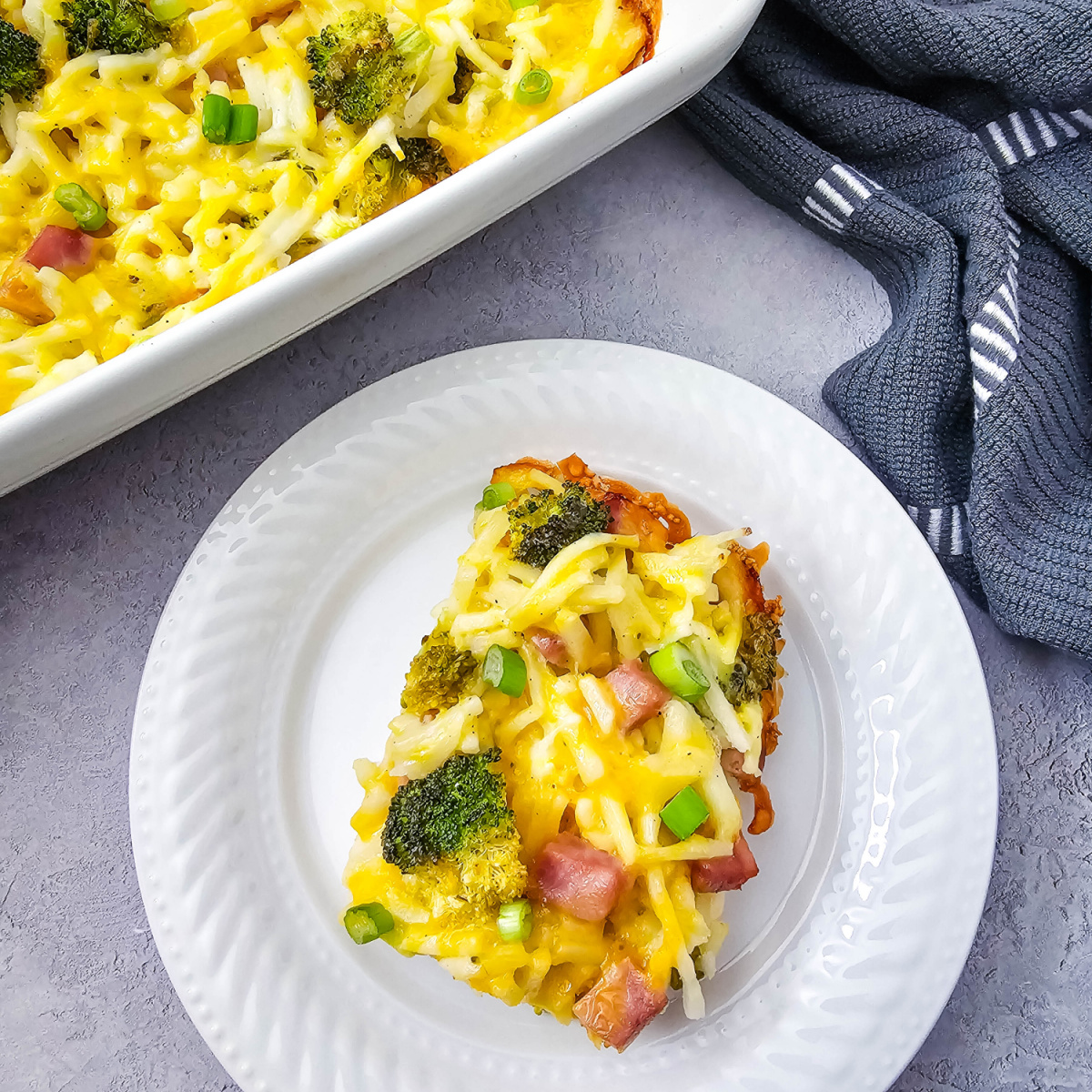 Ham and Broccoli Breakfast Casserole is a hearty brunch bake with hashbrowns, ham, eggs, broccoli, & cheese. Perfect for weekends or holidays