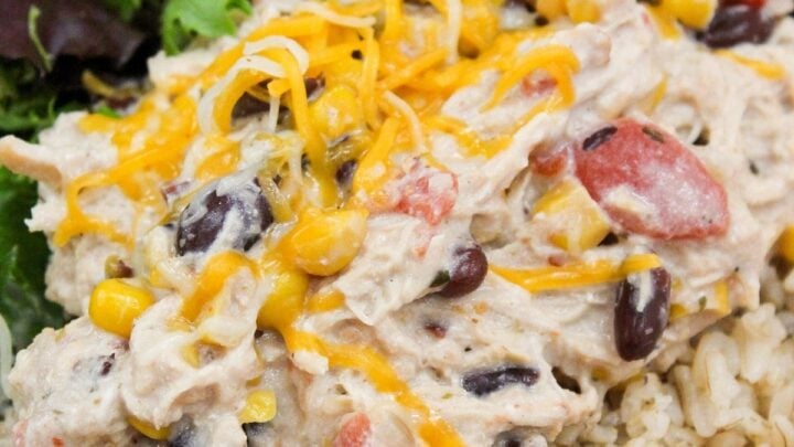 Slow Cooker Cream Cheese Chili Chicken is a weeknight meal. Chicken cooked with beans, corn, tomatoes, peppers, seasoning, and cream cheese.
