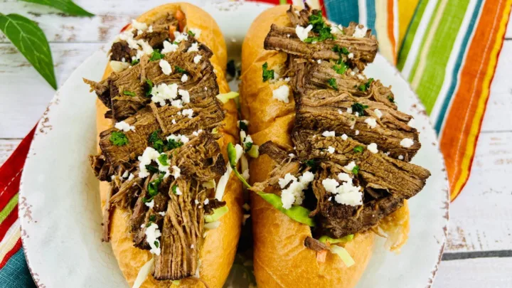 This slow cooker pulled beef torta features tender shredded beef with warm spices like cocoa, cinnamon, and cumin. An easy, comforting meal for any day of the week.
