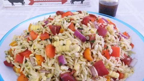 Discover a vibrant Herb Vegetable Orzo Salad packed with fresh corn, tomatoes, peppers, and herbs tossed with a balsamic vinaigrette dressing.
