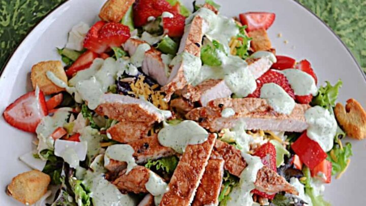 This fresh salad is loaded with juicy strawberries, crunchy sesame seeds, and tender marinated pork, all drizzled with a creamy homemade buttermilk ranch. It’s the perfect mix of bright, bold, and tasty in every bite!