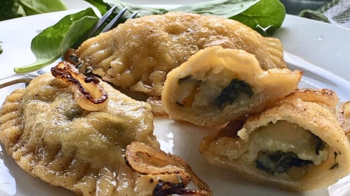 Spinach Ricotta Pierogies use fresh spinach, onions and potatoes, add ricotta. Wrap it all up in homemade dough. A tasty side, lightly fried!