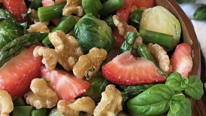 Strawberry Walnut Vegetable Salad. Crunchy walnuts, sweet strawberries, Brussels Sprouts and asparagus in a honey basil balsamic dressing.