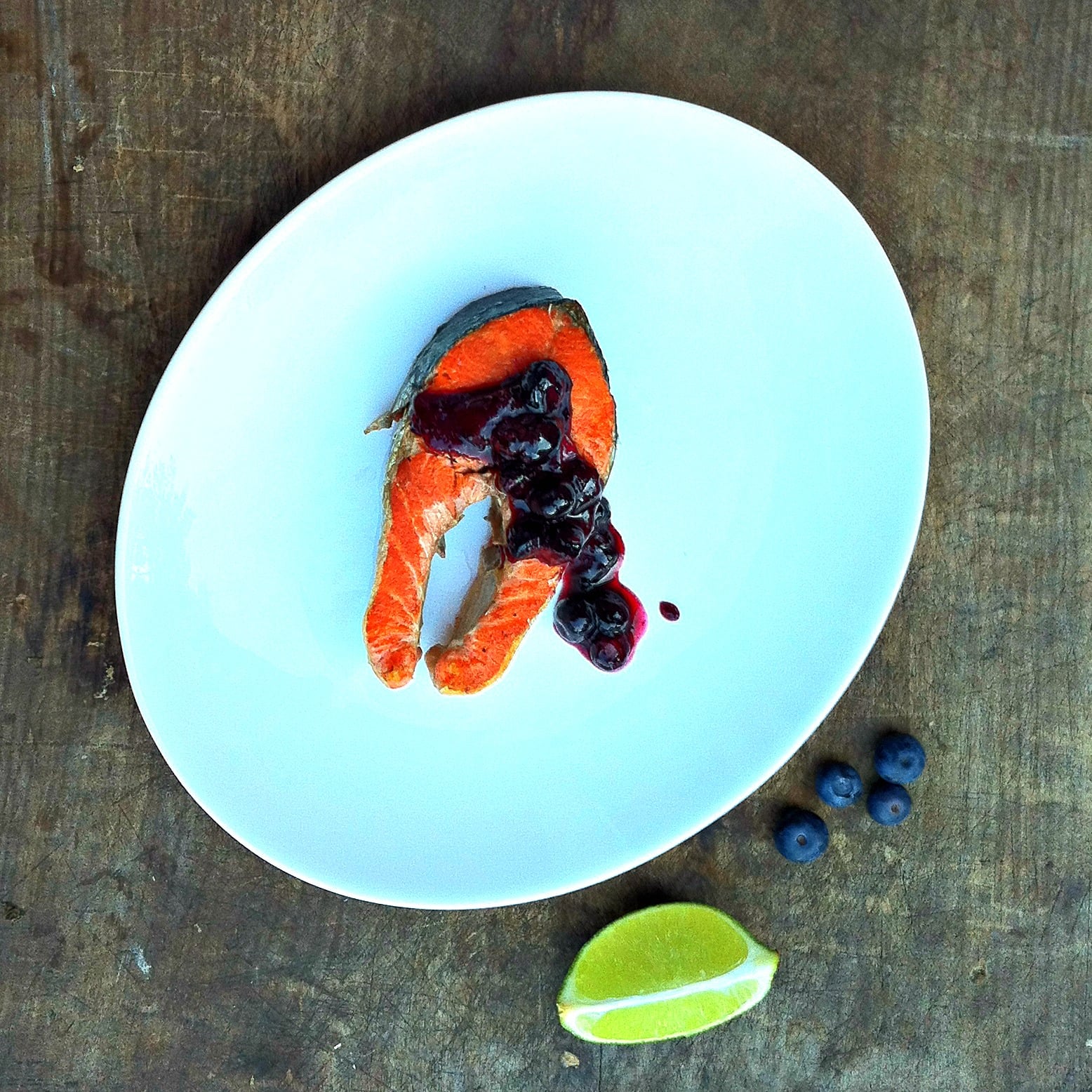 Smoky cedar plank grilled sockeye salmon topped with sweet maple blueberry chutney makes an easy and flavorful summer dinner recipe perfect for grilling season.