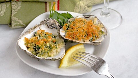 Baked fresh oysters on the half shell, topped with a rich spinach mixture, makes Oysters Rockefeller a tasty and special appetizer.