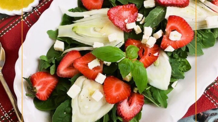 Strawberry Fennel salad is a colorful blend of favors from sweet strawberries, mild licorice from fennel, peppery arugula and creamy feta. Top it with an easy homemade Italian dressing for a simple showstopping salad.