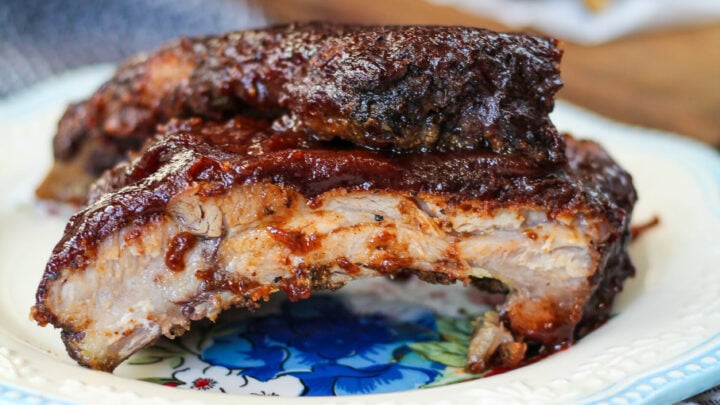Slow roasted fall off the bone oven baked bbq ribs are the perfect addition to your weeknight meal. No-fuss dinners like this are my fave!
