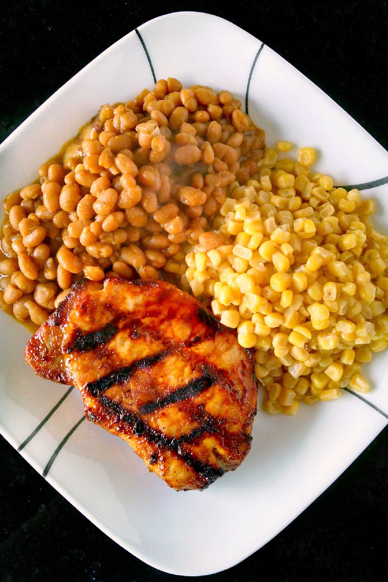 A twist on traditional barbecue sauce, this one replaces the tomato products with mustard. It’s spicy, vinegar-y kick is perfect with the sweet molasses. Mustard Barbecue Chops is our new fave summer meal! #getgrilling #porkchop #grilledchop #mustardsauce #barbecuesauce #MustardBBQChops #FlavorfulChops #SauceUpYourChops #PorkPerfection
