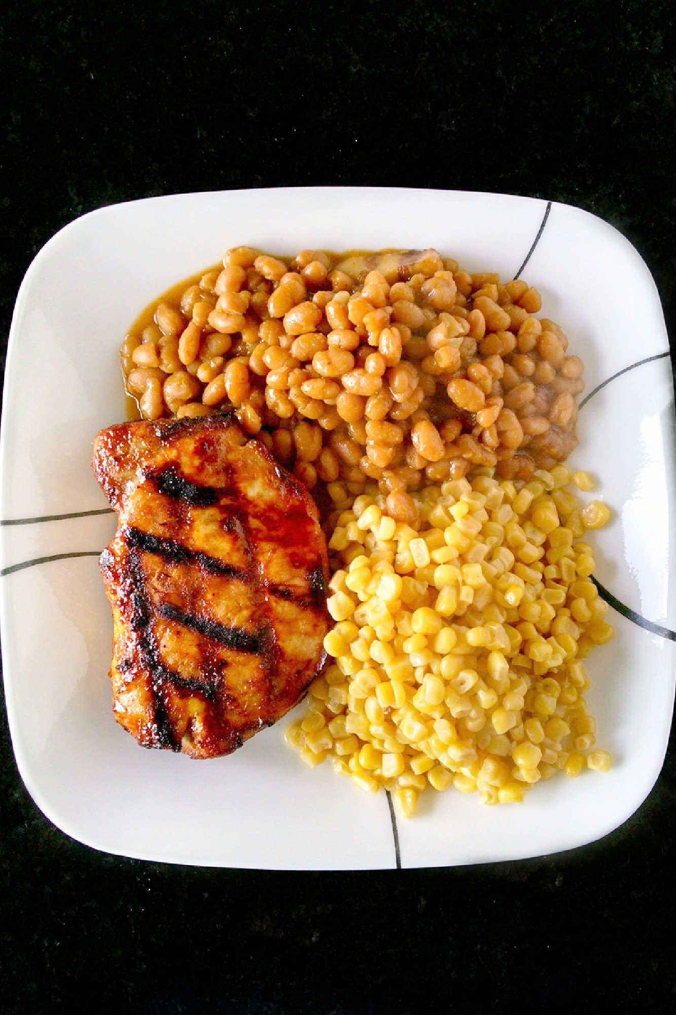 A twist on traditional barbecue sauce, this one replaces the tomato products with mustard. It’s spicy, vinegar-y kick is perfect with the sweet molasses. Mustard Barbecue Chops is our new fave summer meal! #getgrilling #porkchop #grilledchop #mustardsauce #barbecuesauce #MustardBBQChops #FlavorfulChops #SauceUpYourChops #PorkPerfection