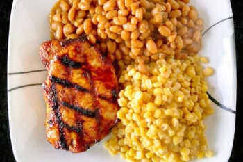 A twist on traditional barbecue sauce, this one replaces the tomato products with mustard. It’s spicy, vinegar-y kick is perfect with the sweet molasses. Mustard Barbecue Chops is our new fave summer meal! #getgrilling #porkchop #grilledchop #mustardsauce #barbecuesauce #MustardBBQChops #FlavorfulChops #SauceUpYourChops #PorkPerfection